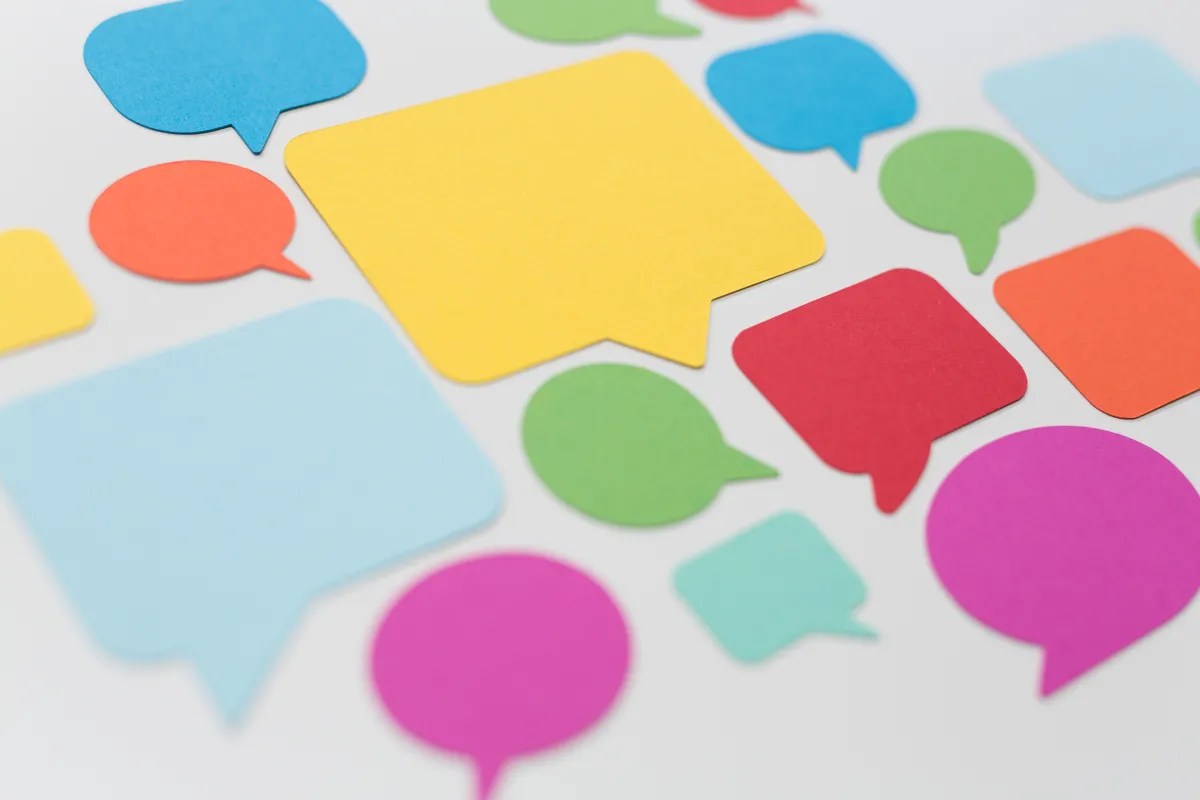 Colorful paper cut-outs of speech bubbles
