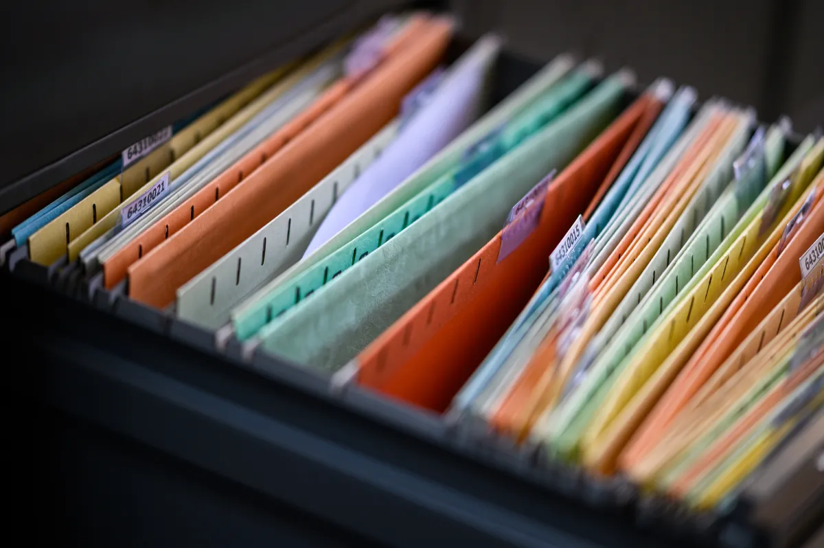 image of a file drawer with colorful file folders and labels