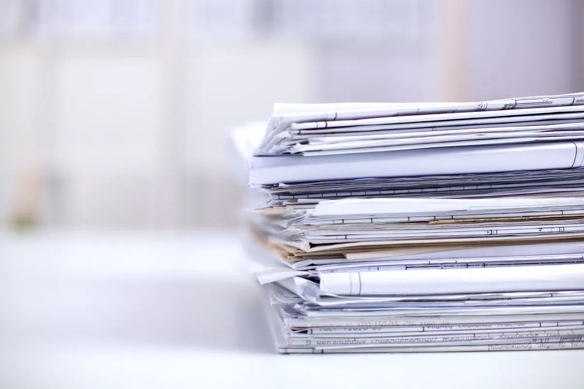 a pile of various papers and files