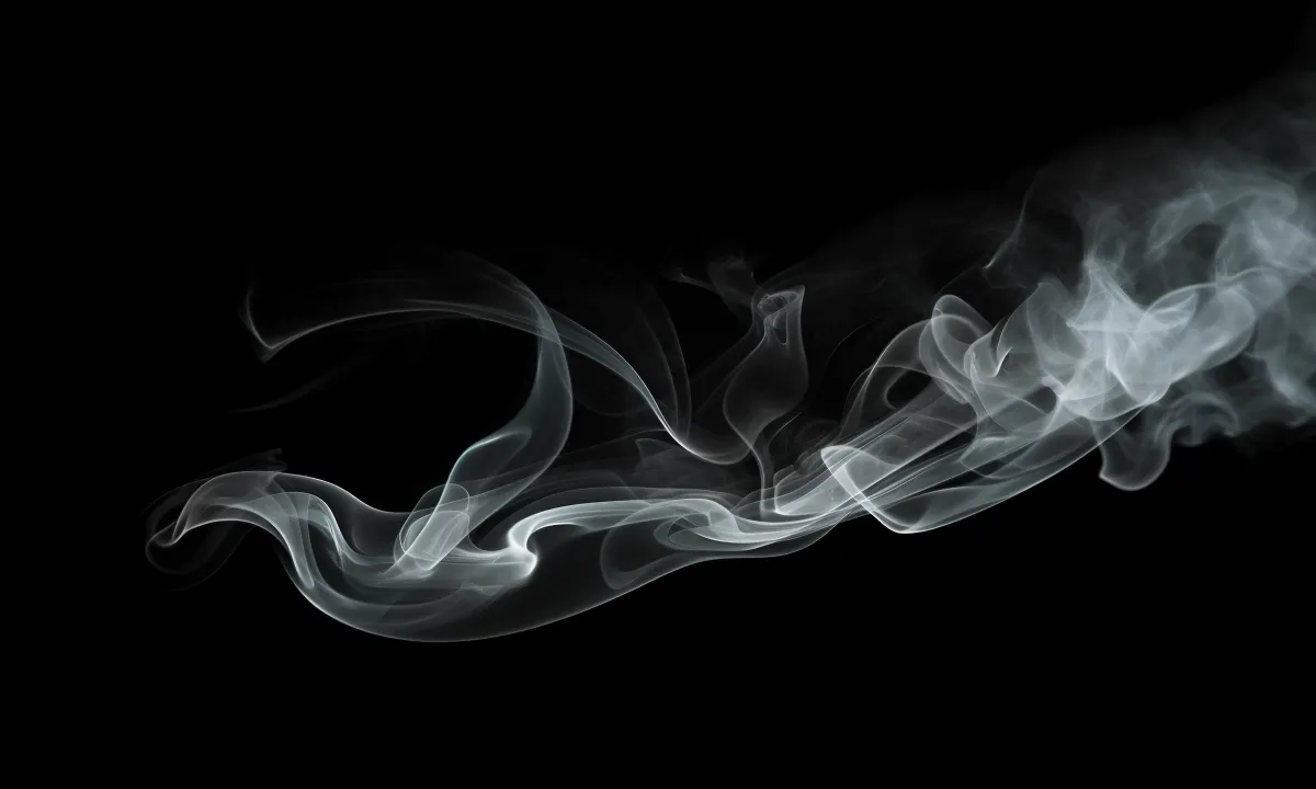 wisps of smoke on a black background