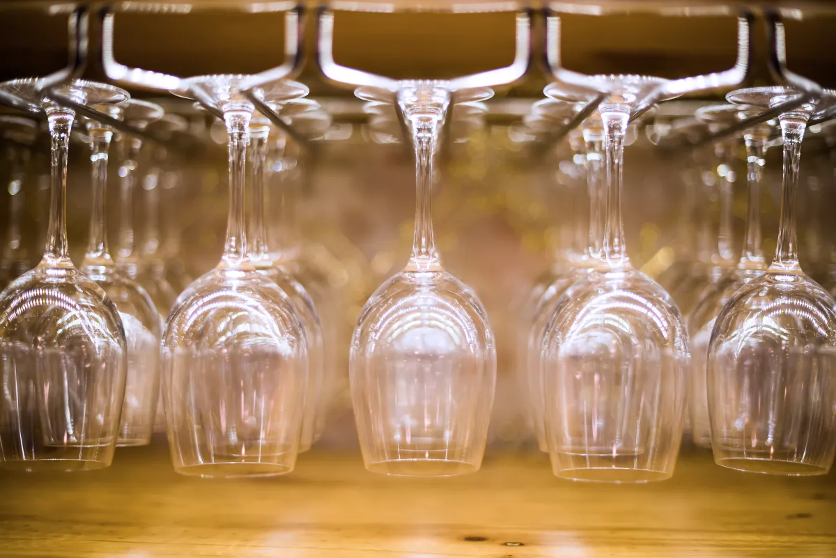 empty wine glasses hanging upside-down