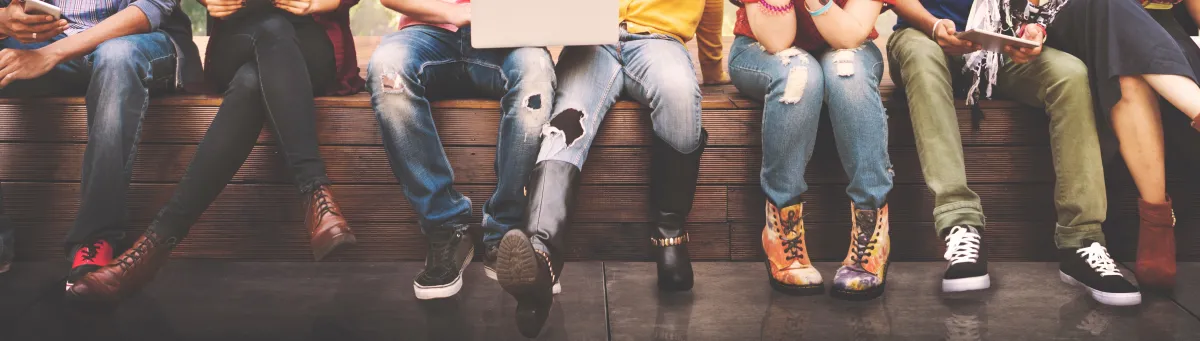 a line of young people sitting together